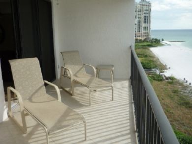 Balcony at condo with chairs over looking the Gulf and Beach
